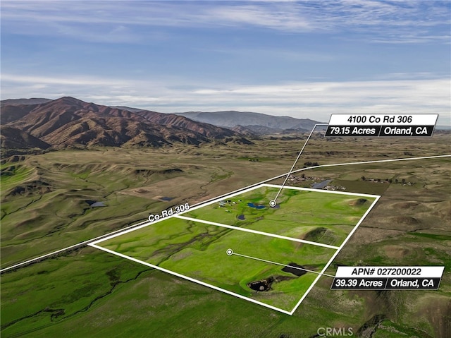 drone / aerial view featuring a mountain view