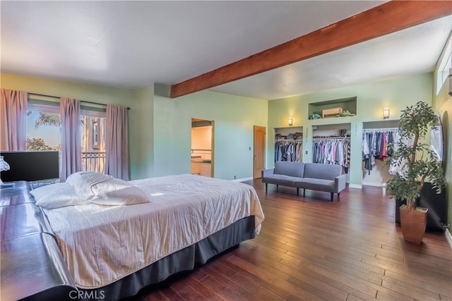 bedroom with beam ceiling and dark wood-type flooring