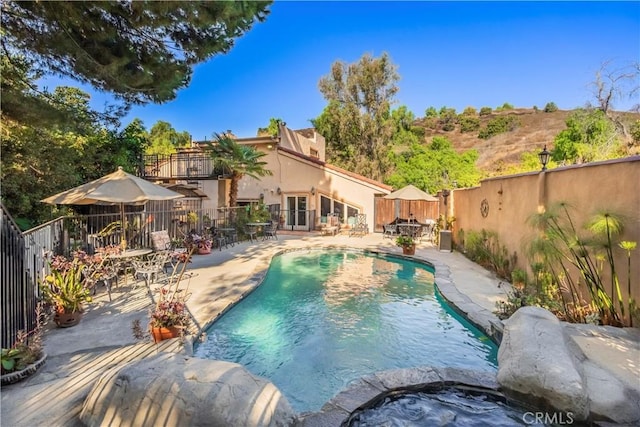 view of swimming pool with a patio area