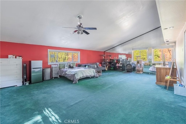 unfurnished bedroom with ceiling fan, stainless steel fridge, carpet floors, and multiple windows