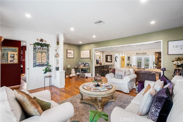 living room with light hardwood / wood-style flooring