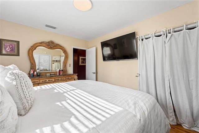 bedroom featuring hardwood / wood-style floors