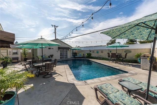 view of swimming pool featuring a patio