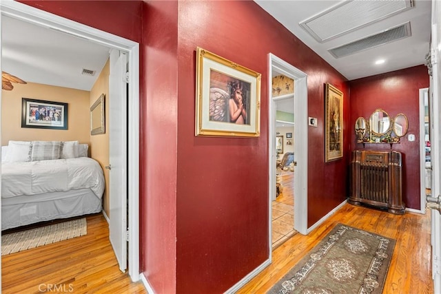 hallway featuring hardwood / wood-style flooring