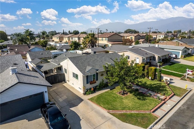 birds eye view of property featuring a mountain view