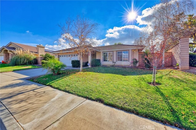 ranch-style house with a garage and a front yard