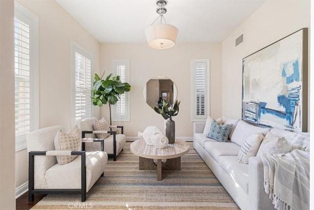 living room with dark hardwood / wood-style flooring