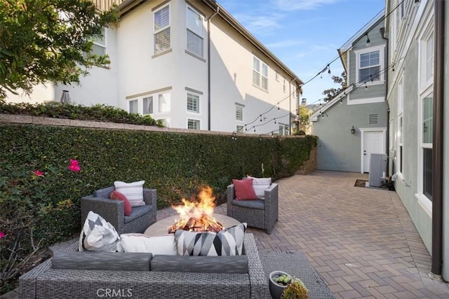 view of patio / terrace featuring a fire pit