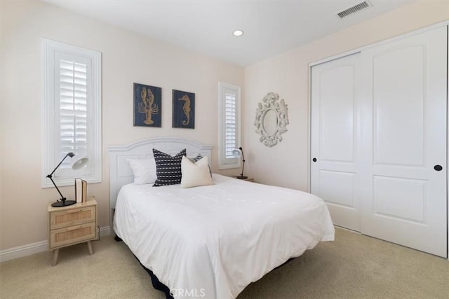 carpeted bedroom featuring a closet