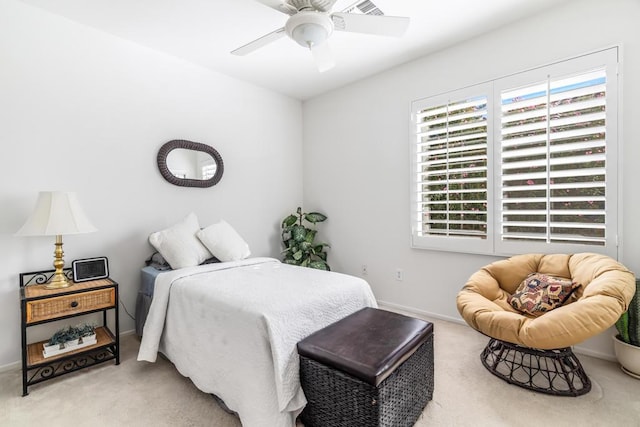 bedroom with carpet, ceiling fan, and multiple windows