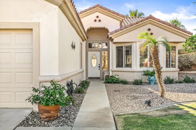 entrance to property featuring a garage