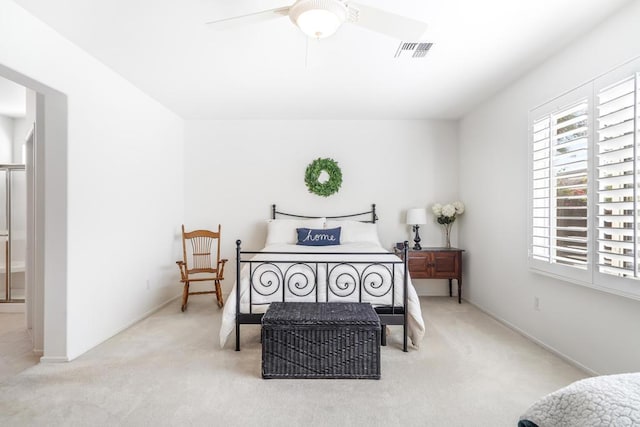 bedroom featuring light carpet and ceiling fan