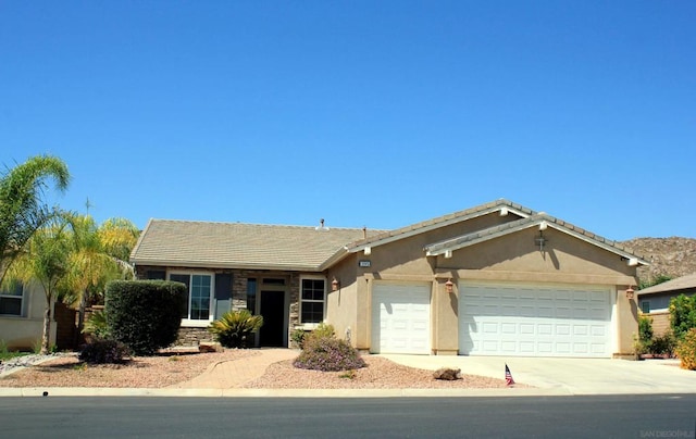 single story home featuring a garage