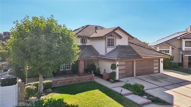 view of front property with a garage and a front lawn