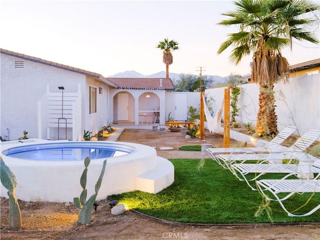 view of swimming pool featuring an outdoor fire pit and a patio area