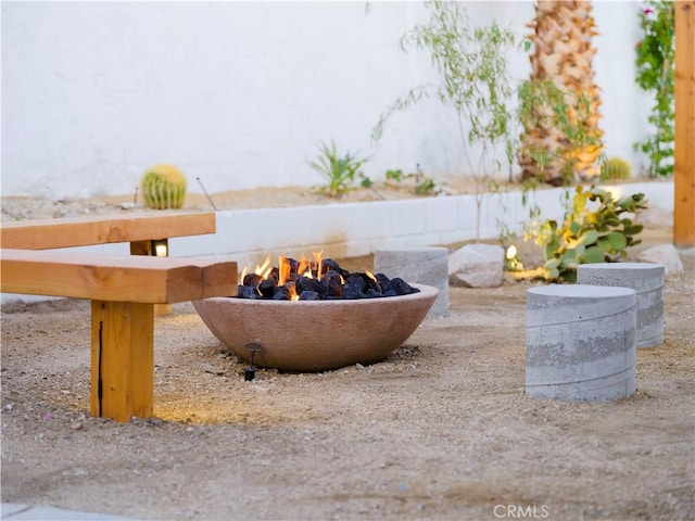 exterior space with a fire pit