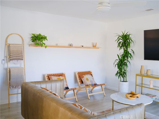 living area with hardwood / wood-style floors