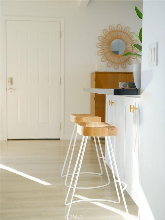 unfurnished dining area featuring wood-type flooring