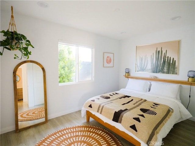 bedroom with light hardwood / wood-style flooring