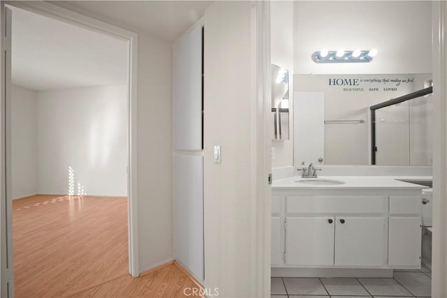 bathroom with vanity and wood-type flooring