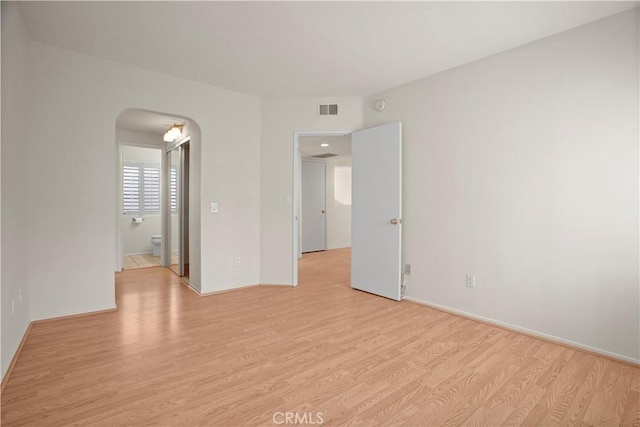 unfurnished room with light hardwood / wood-style flooring