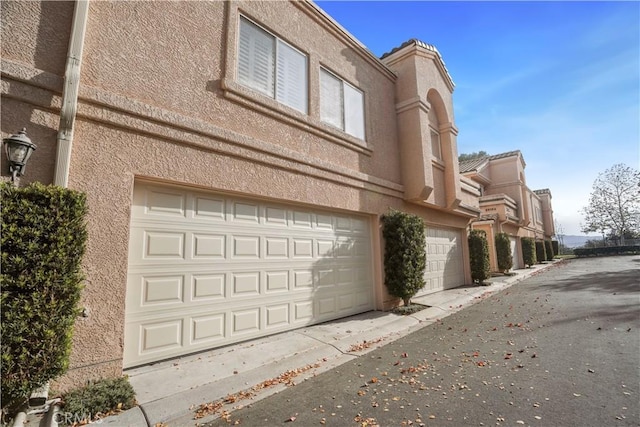 exterior space with a garage