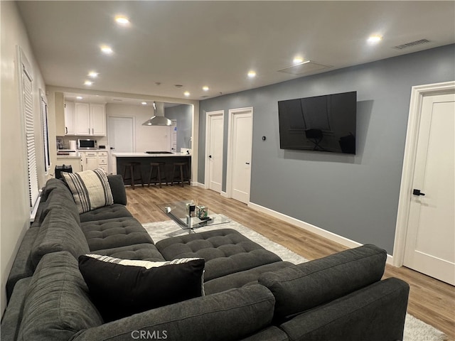 living room with light hardwood / wood-style floors