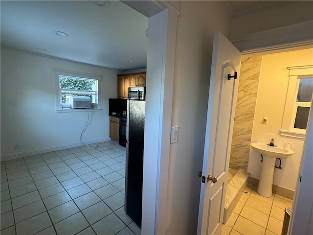 corridor with cooling unit, light tile patterned floors, and sink