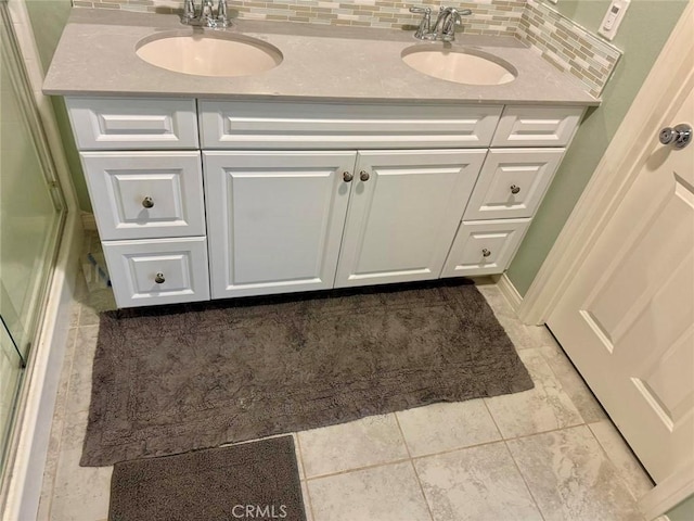 bathroom with decorative backsplash and vanity