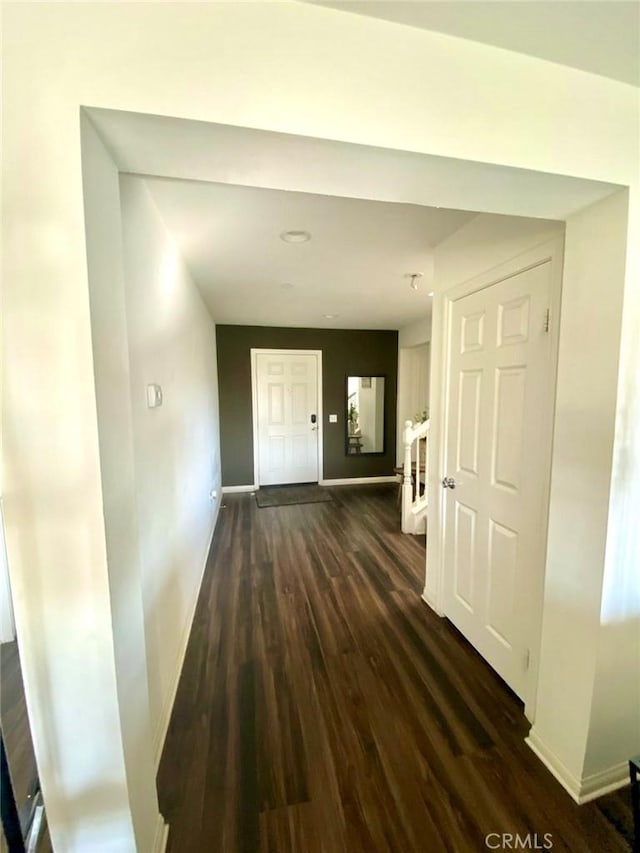 hall featuring dark wood-type flooring