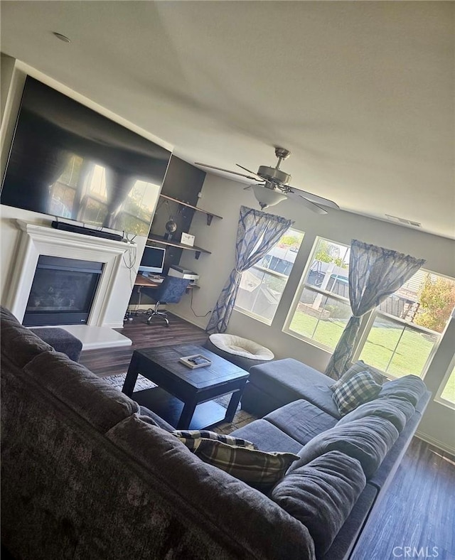 living room featuring hardwood / wood-style flooring and ceiling fan