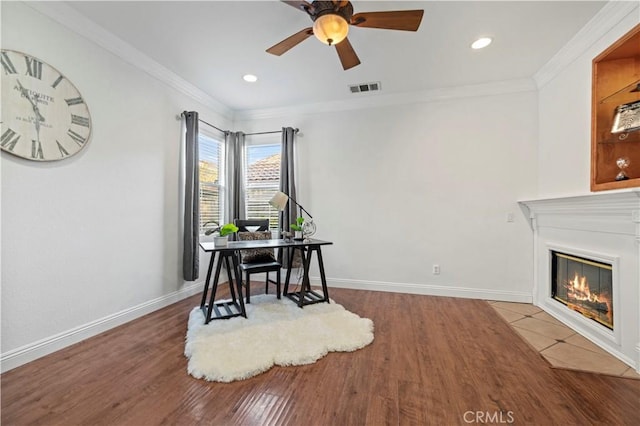 office area with hardwood / wood-style flooring, ceiling fan, and crown molding