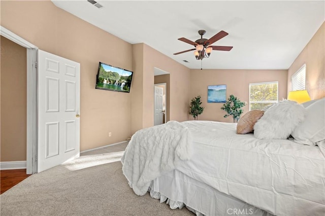 bedroom featuring carpet flooring, ceiling fan, and vaulted ceiling