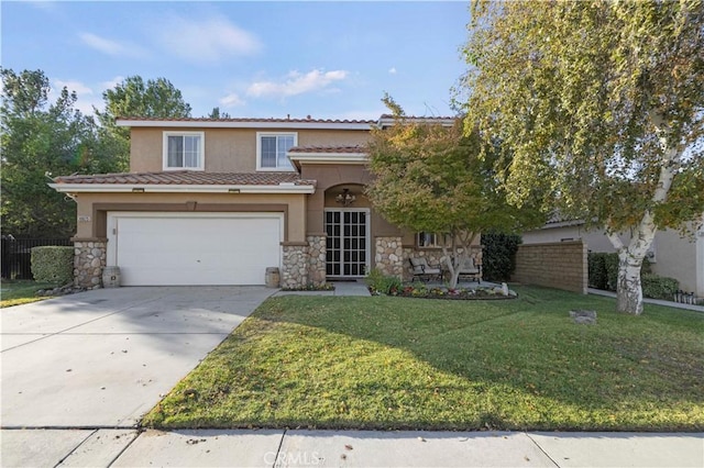 view of front of property with a garage and a front lawn