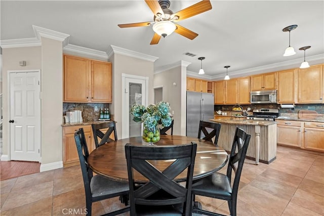 dining space with ceiling fan, light tile patterned floors, and crown molding