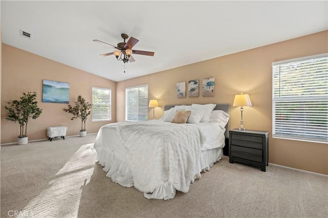 carpeted bedroom featuring ceiling fan and lofted ceiling