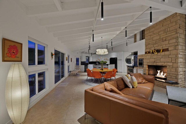 tiled living room featuring high vaulted ceiling, beam ceiling, and a fireplace