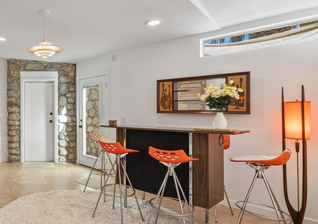 bar with light tile patterned floors