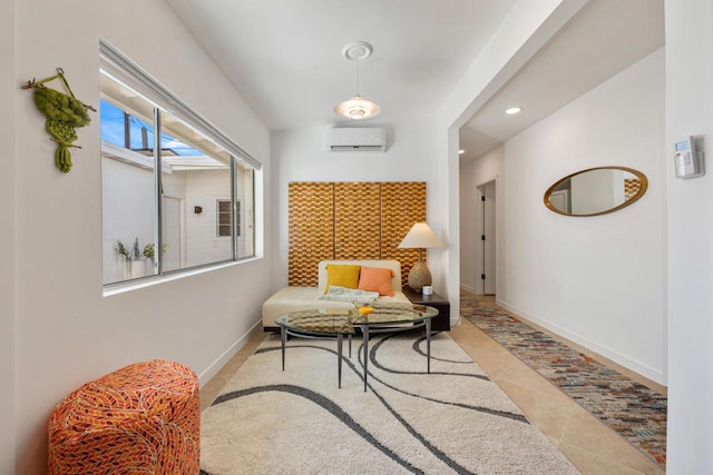 sitting room with light tile patterned floors and a wall mounted air conditioner