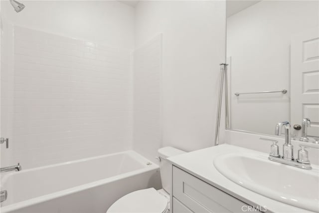 bathroom with shower / bath combination, vanity, and toilet