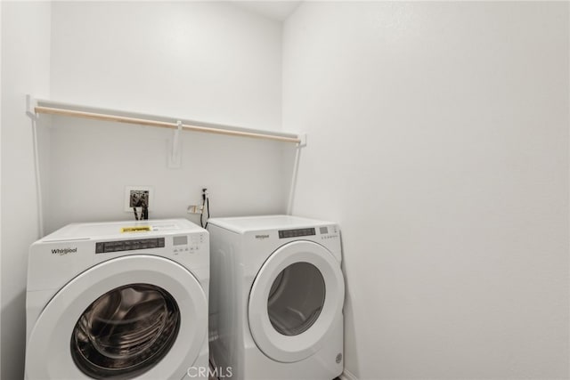 washroom with laundry area and washing machine and dryer