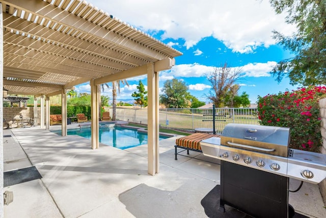 view of pool featuring a pergola, grilling area, and a patio area