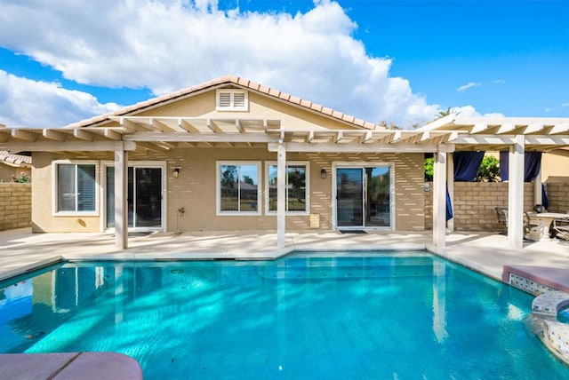 view of swimming pool featuring a patio area and a pergola