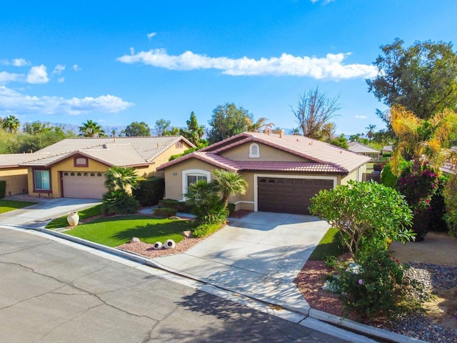 view of front of home with a garage and a front yard