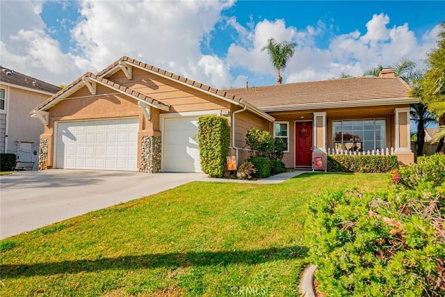 view of front of home featuring a garage and a front yard