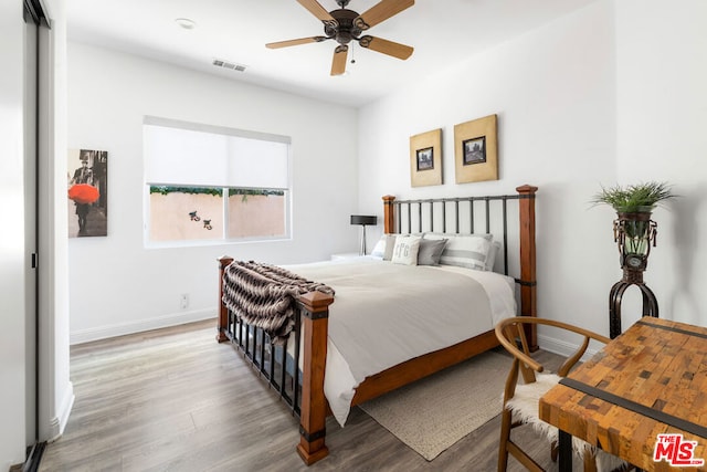 bedroom featuring ceiling fan and wood-type flooring