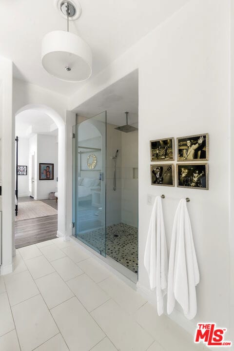 bathroom featuring tile patterned floors and walk in shower