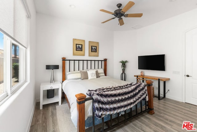 bedroom featuring ceiling fan and wood-type flooring