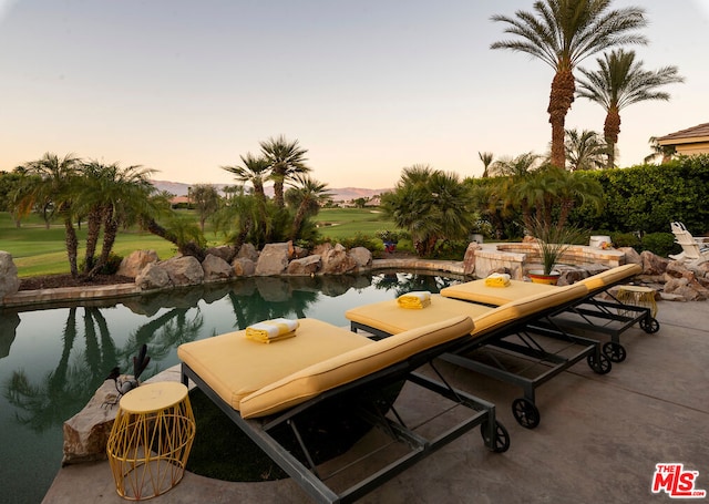 view of patio terrace at dusk