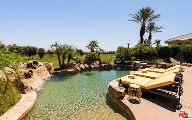 view of swimming pool with a water view